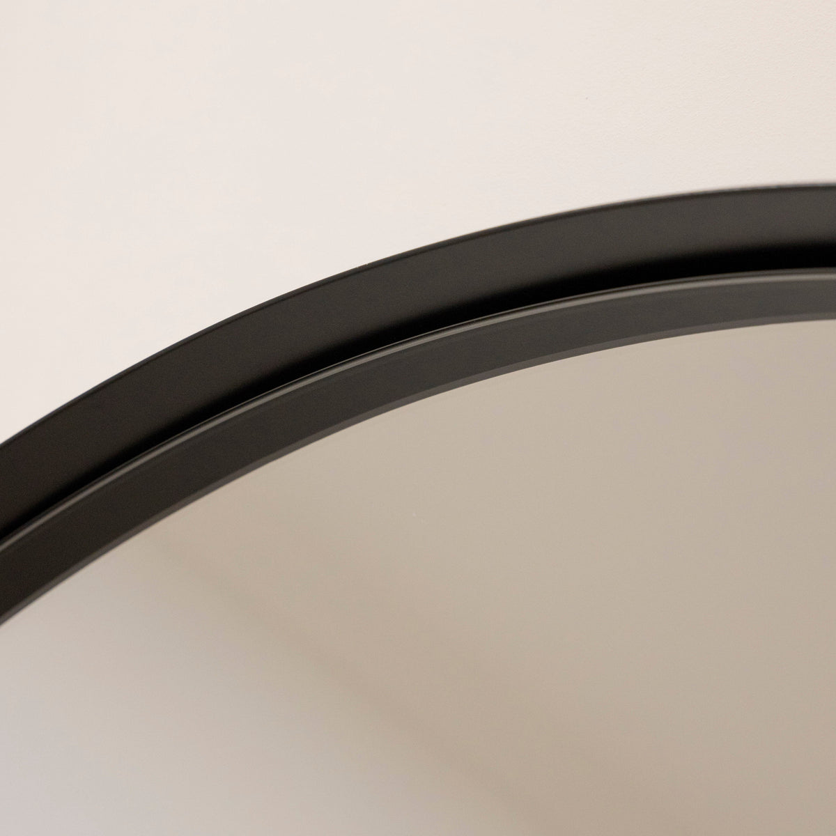 Full length arched black extra large metal mirror closeup