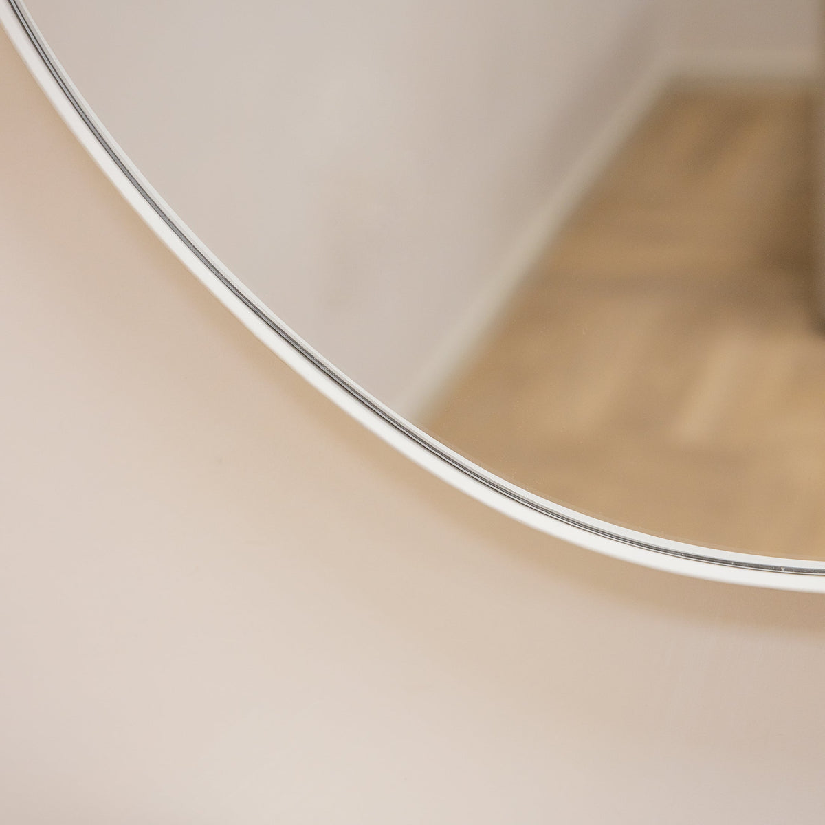 Ecru metal pond shaped irregular wall mirror closeup