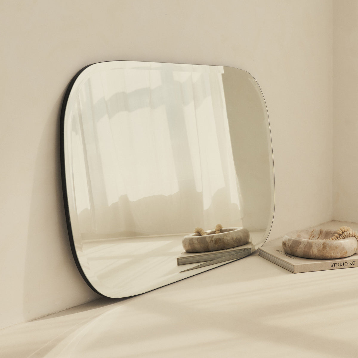 Vienna - Large Frameless Curved Bevelled Mirror 100cm x 65cm
