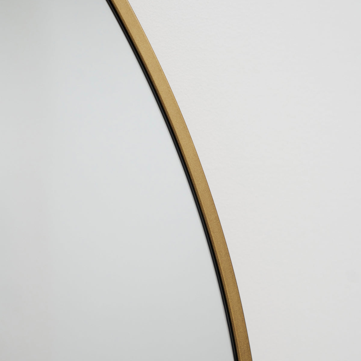 Gold Full Length Arched Metal Mirror detail shot of gold curved frame