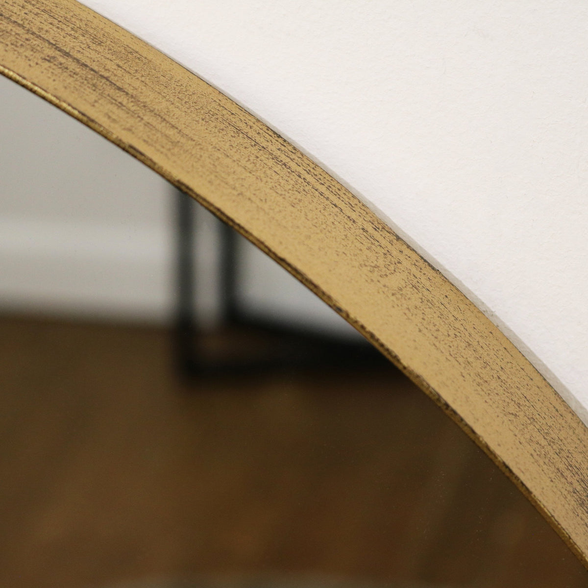 Closeup of Full length arched gold large metal mirror