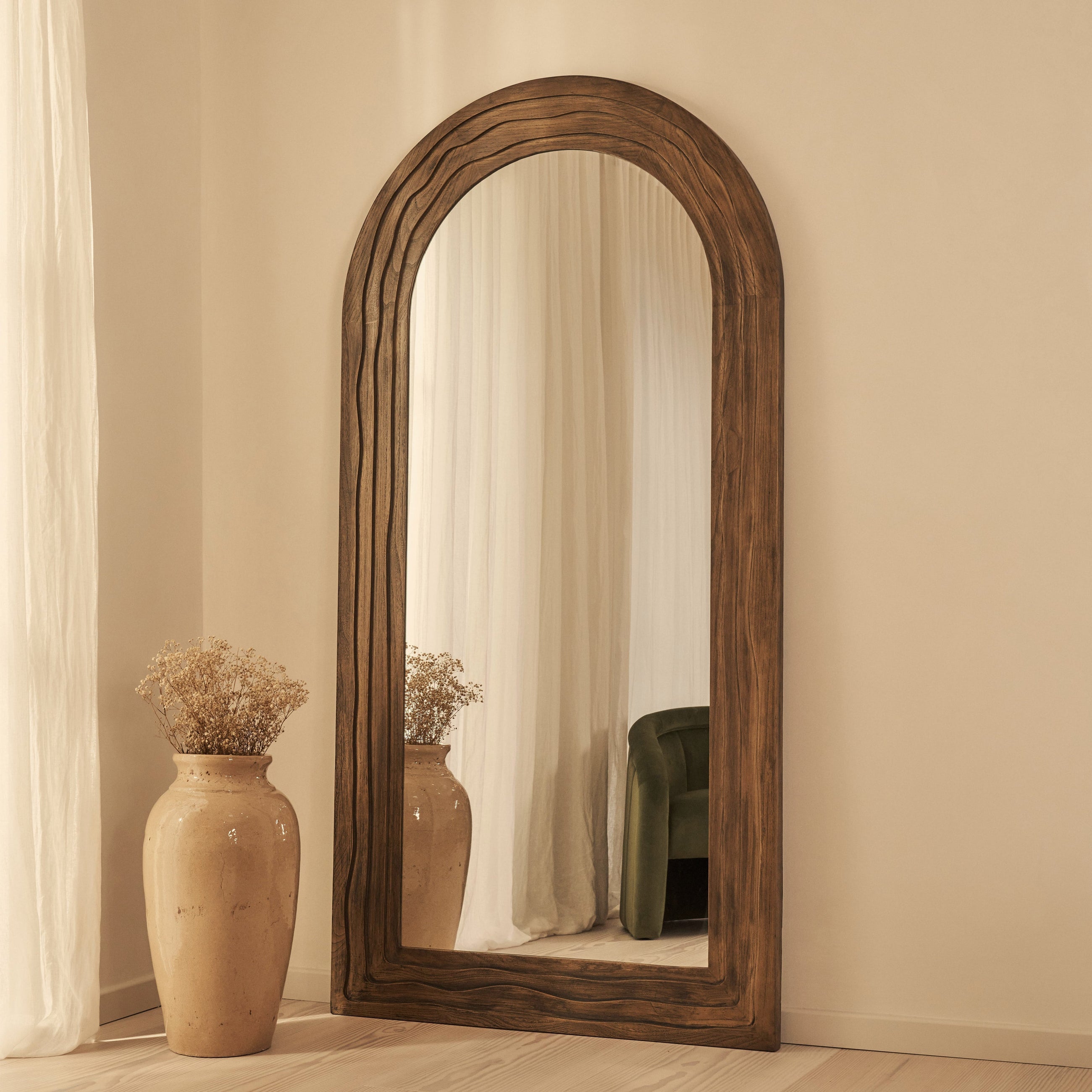 Full Length Arched mirror leaning against a wall