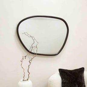 Organic irregular walnut-coloured wooden wall mirror displayed horizontally