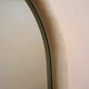 Closeup of Full length arched concrete mirror