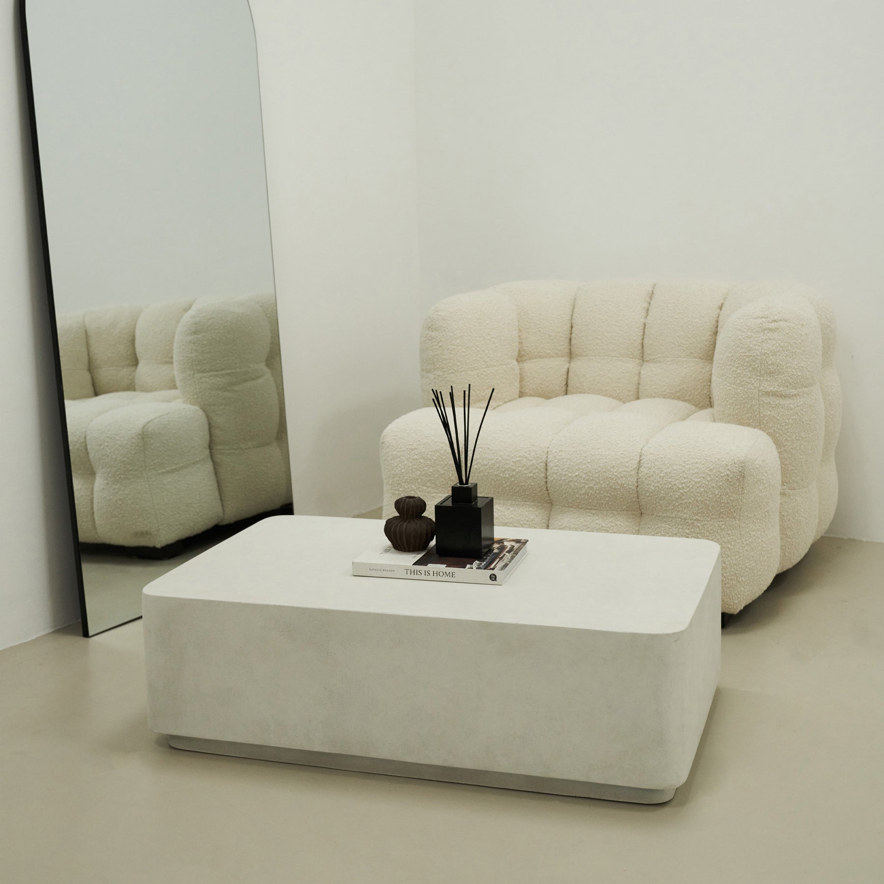 Minimal Concrete Rectangular Coffee Table Large in a typical setting, beside sofa and mirror