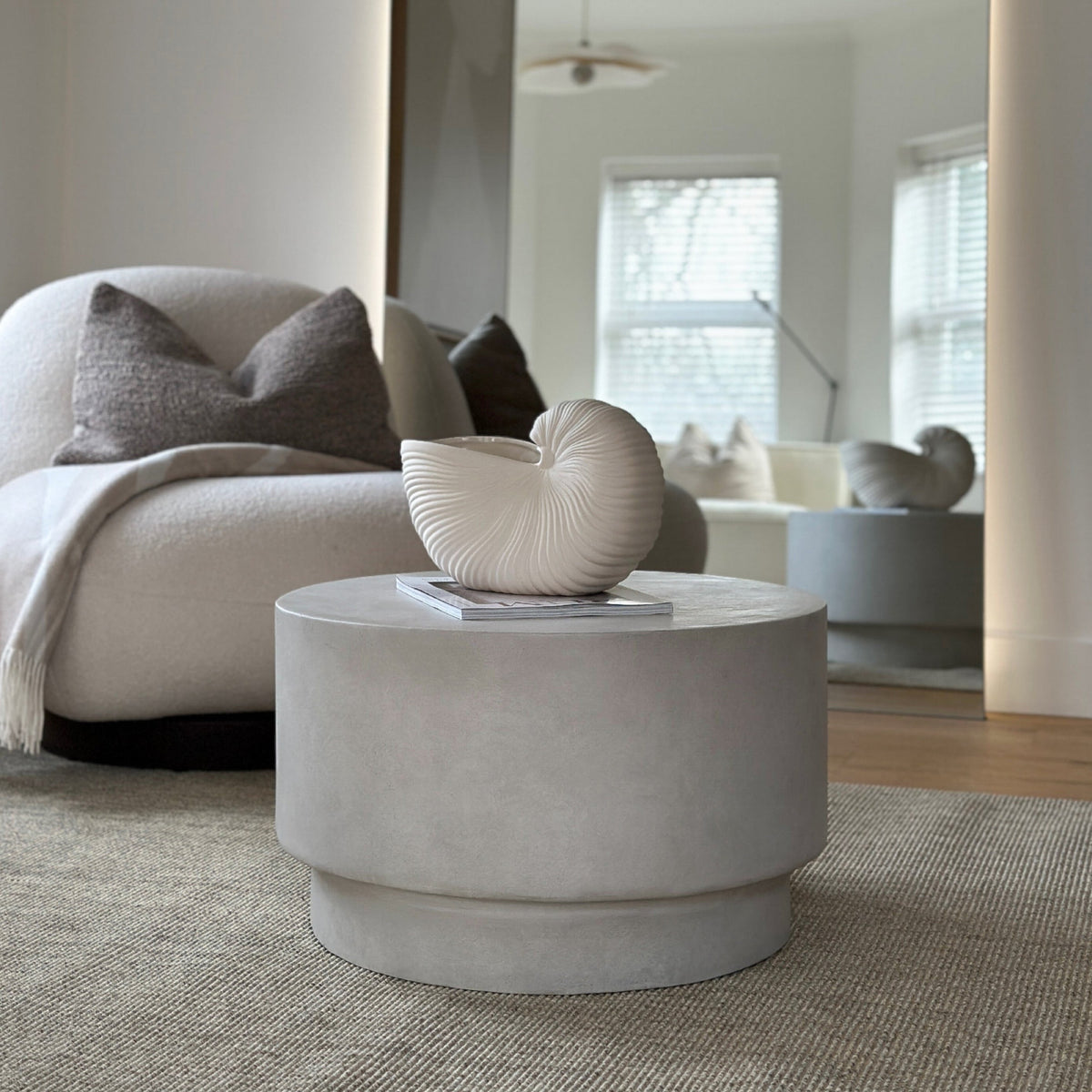 Minimalist concrete round coffee table displayed in living room