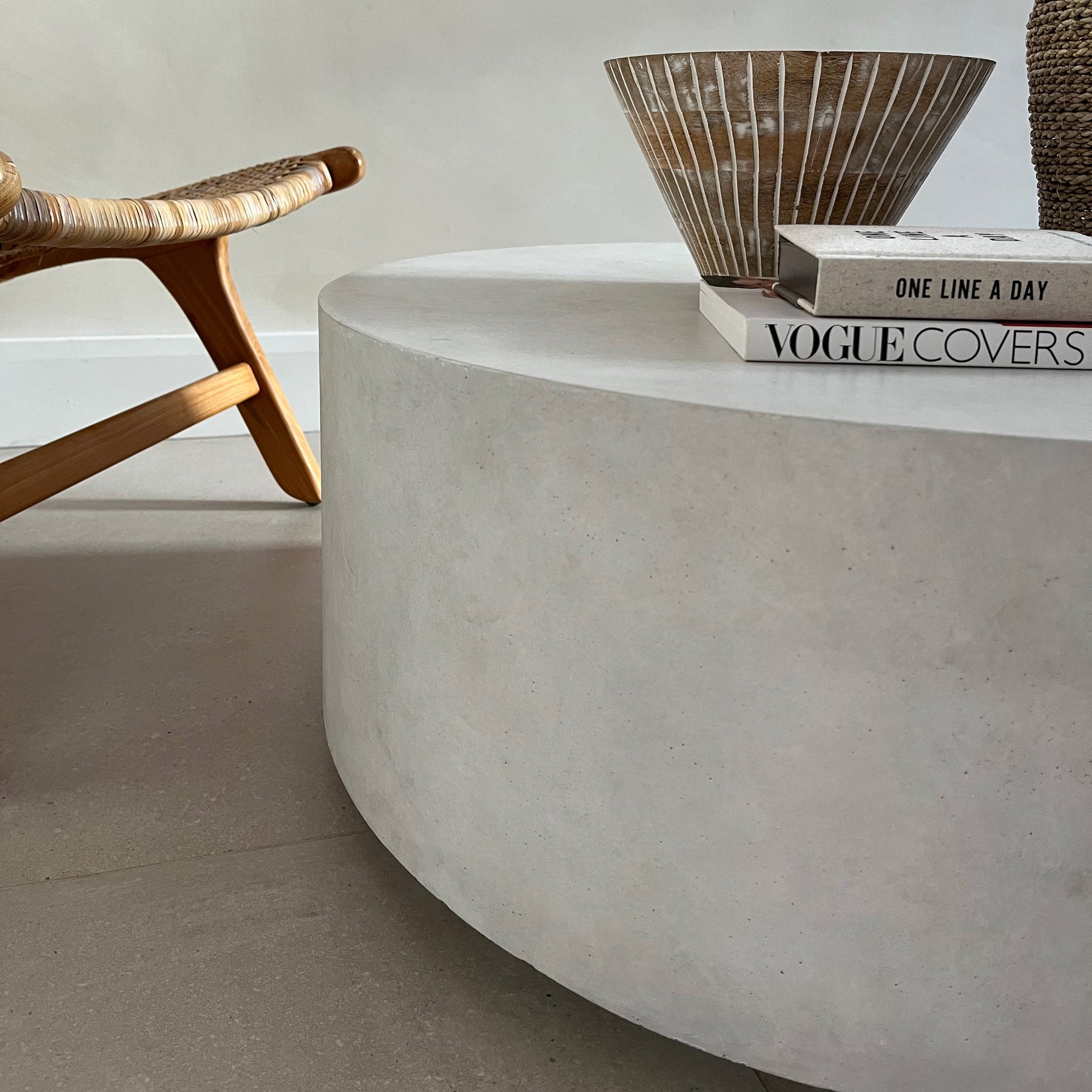 Closeup of Large minimalist concrete round coffee table