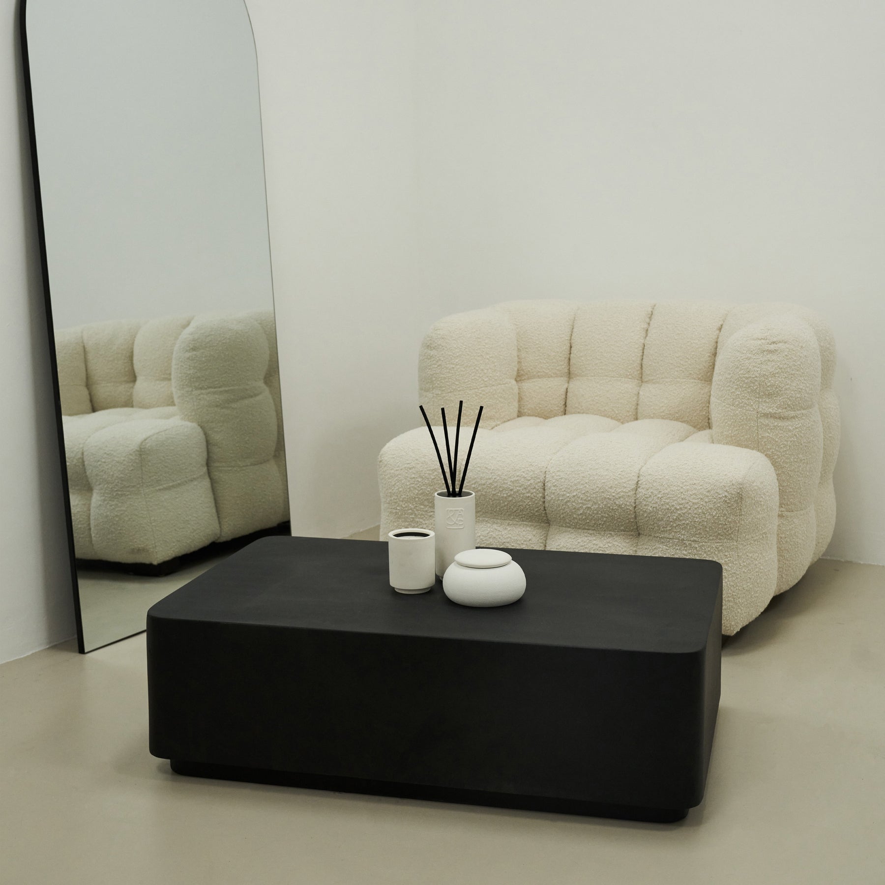 Minimal Onyx Rectangular Coffee Table Large in a typical setting, with a sofa & mirror