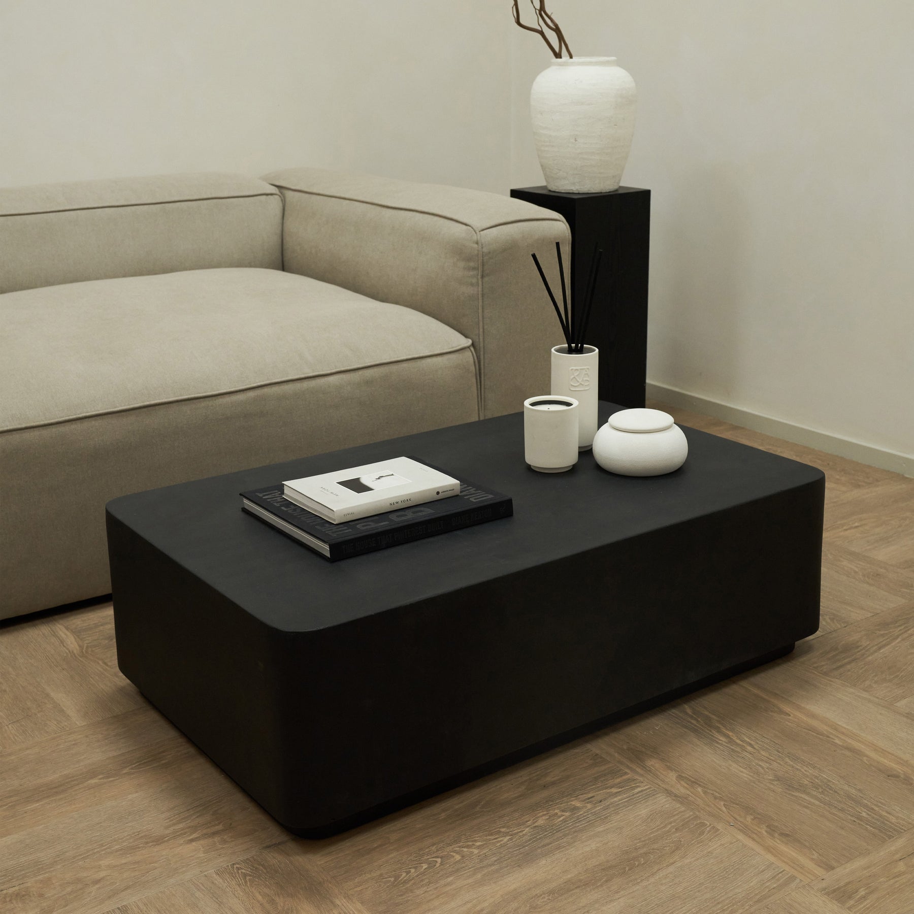 Minimal Onyx Rectangular Coffee Table Large beside sofa and plinth