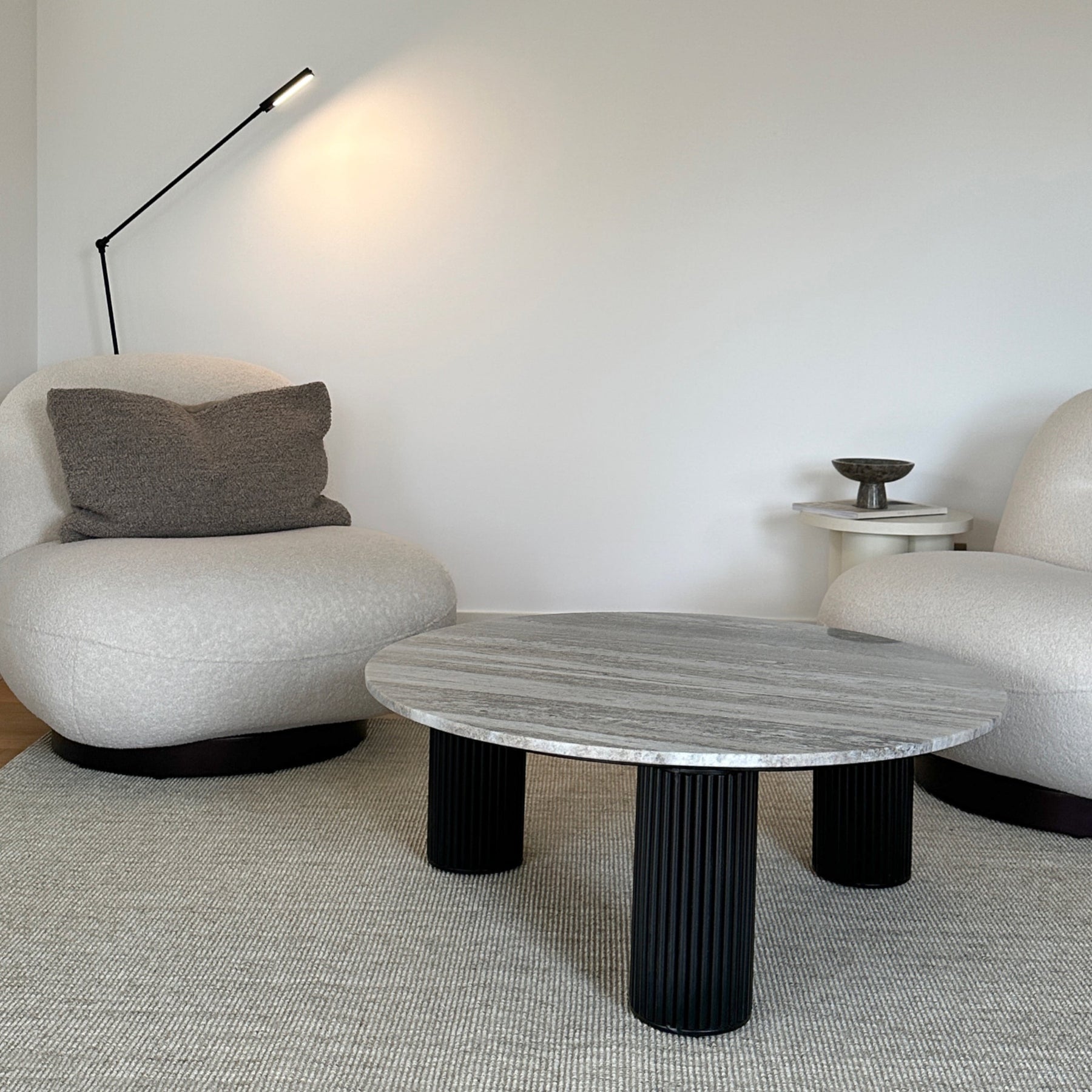 Travertine round large coffee table displayed in living room