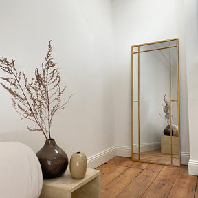 Gold industrial full length metal mirror closeup