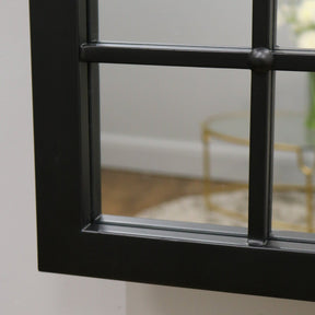 Black industrial metal console mirror closeup of corner