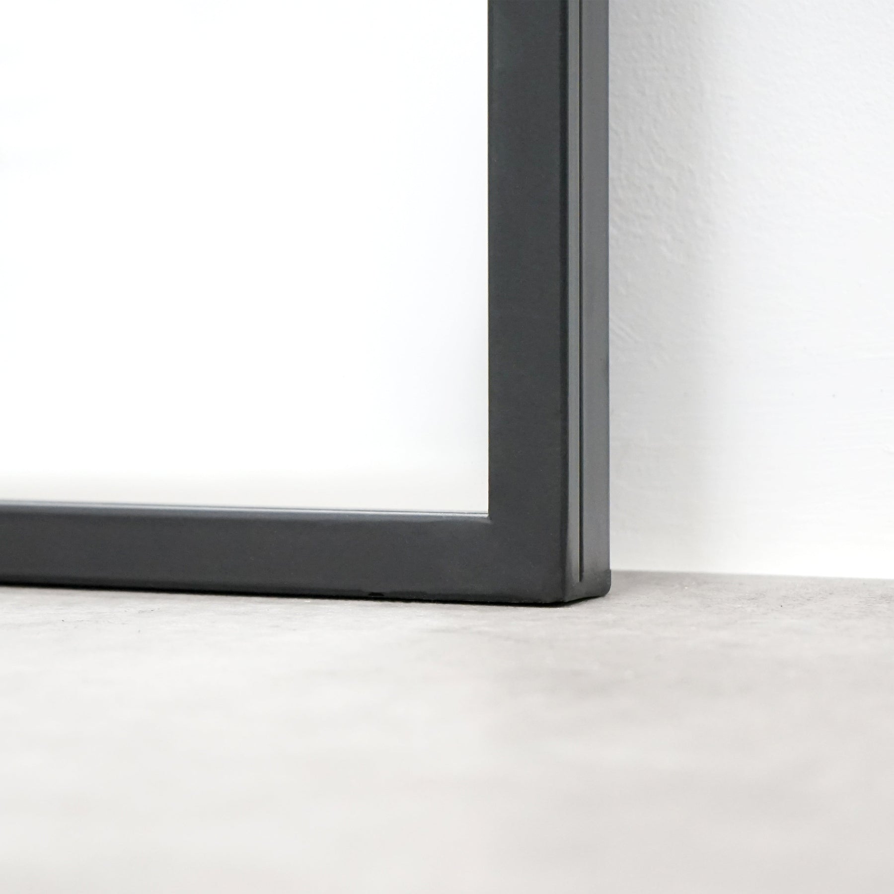 Closeup of Full length XXL black industrial metal window mirror