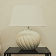 Textured ceramic based table lamp natural shade on brookyln side table