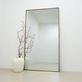 Full Length Gold Extra Large Metal Mirror leaning against wall