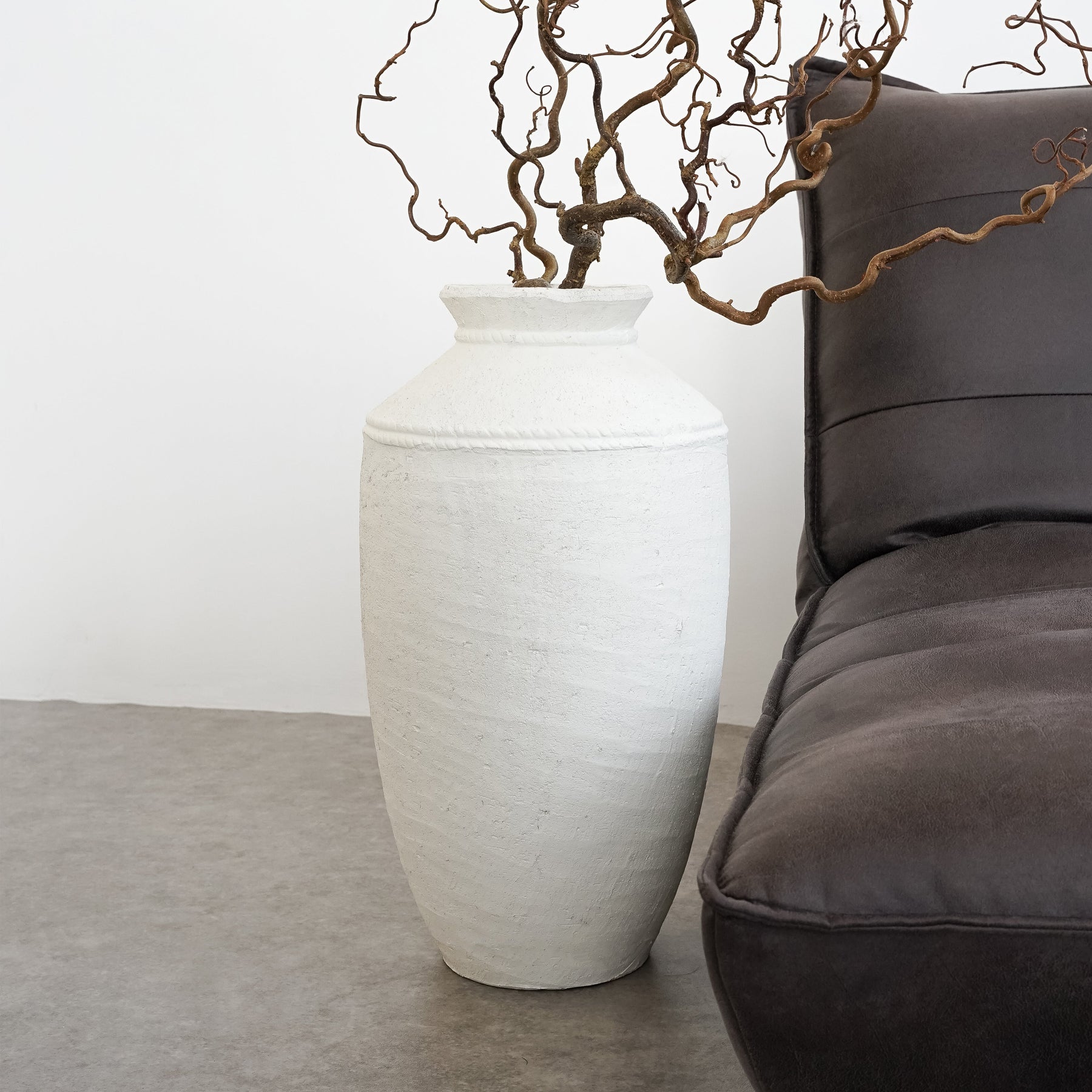 White Textured Terracotta Large Vase beside sofa