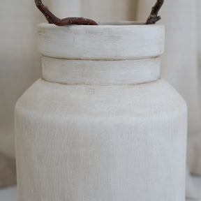 Beige textured ceramic small vase detail shot