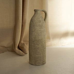 Beige Textured Terracotta Small Vase in front of fabric