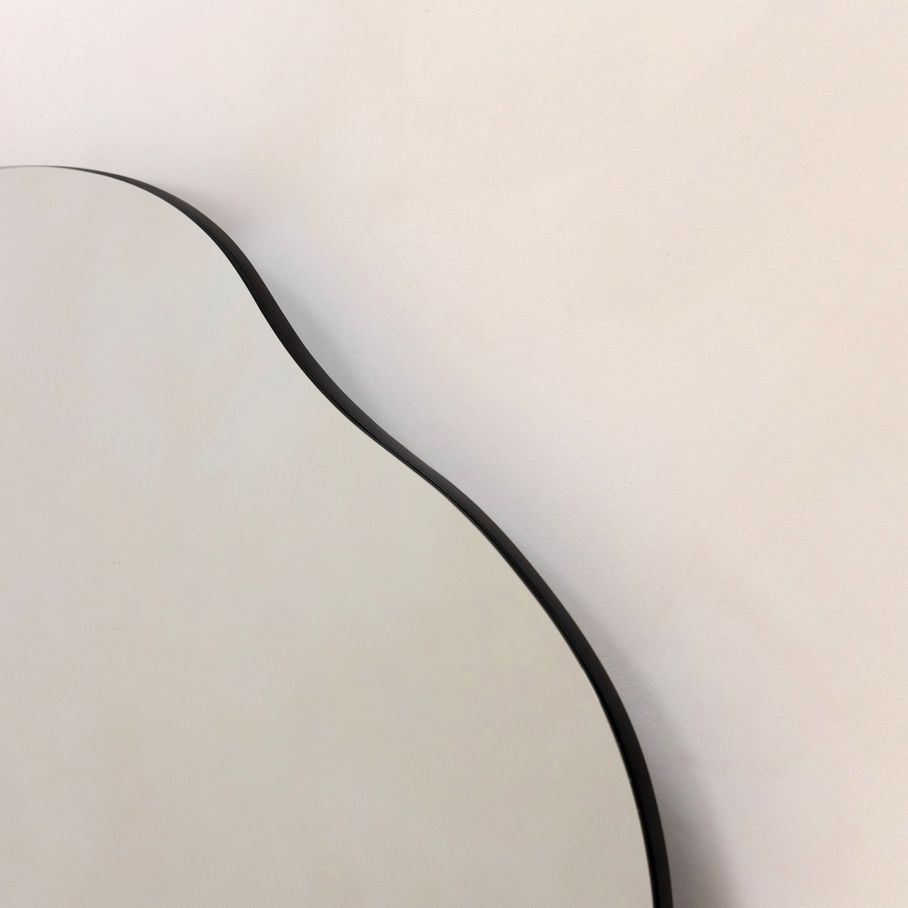 Large Frameless Pond Mirror detail shot of irregular curve