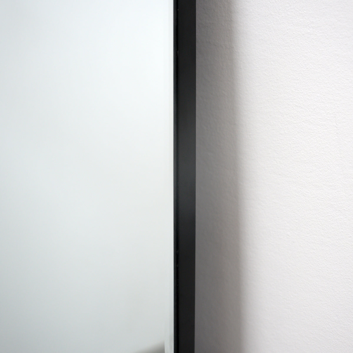 Extra large frameless full length rectangular mirror side