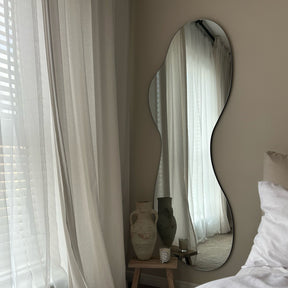 Large Frameless Full Length Pond Mirror beside bed