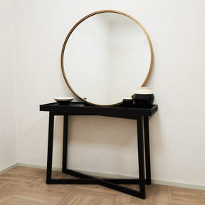 Gold Metal Modern Round Wall Mirror leaning against wall