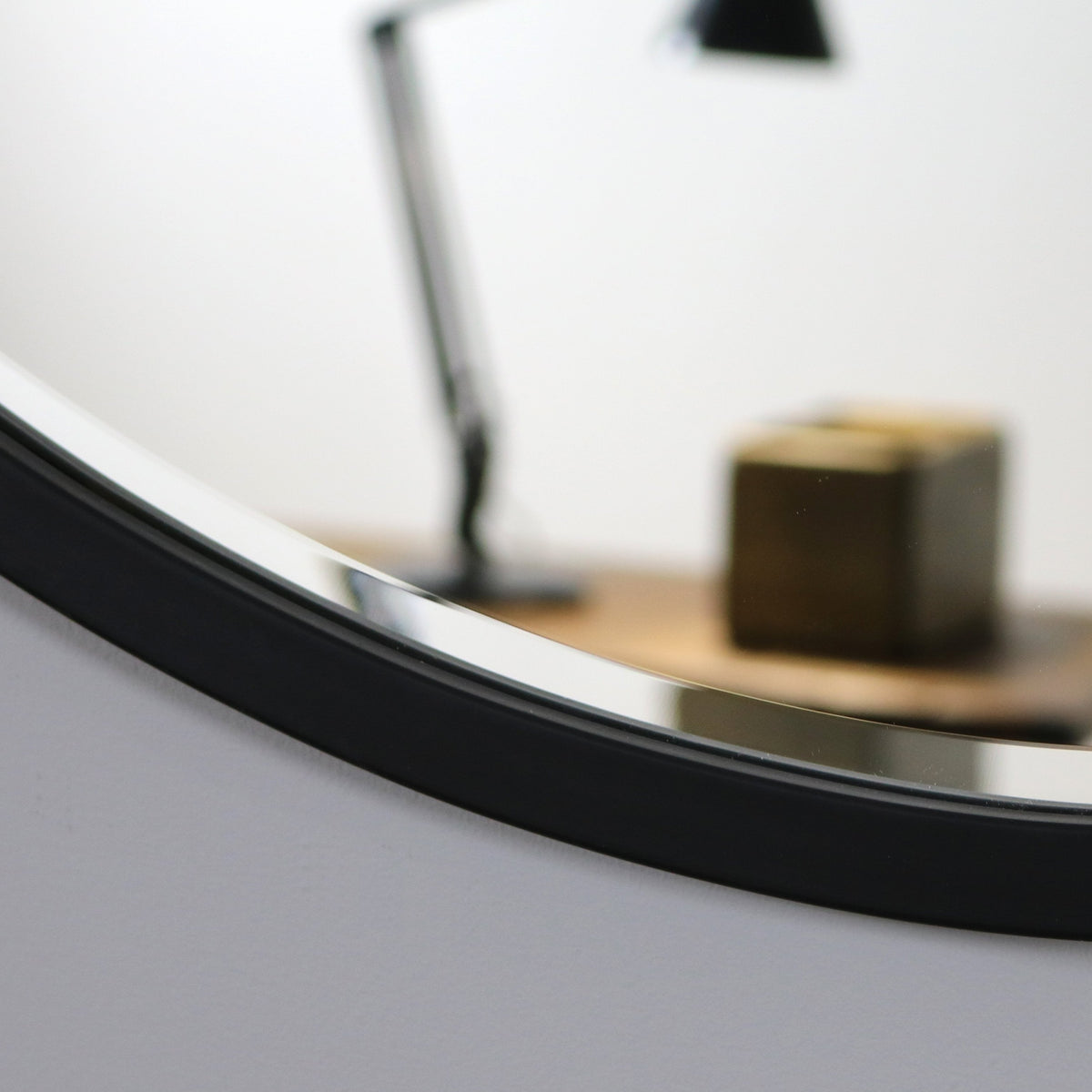 Black Metal Modern Round Wall Mirror detail shot of curve