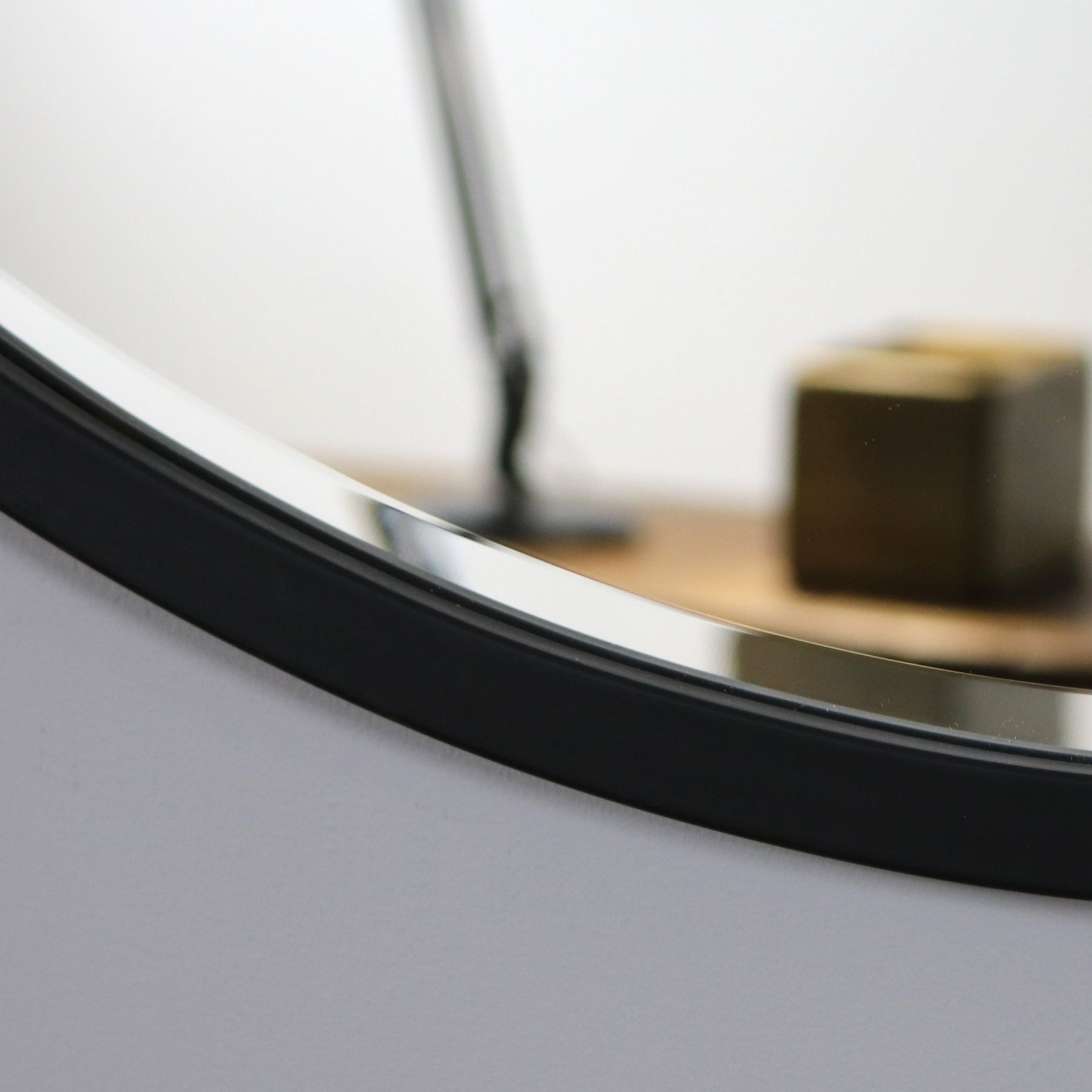 Black Metal Modern Round Wall Mirror detail shot of curve