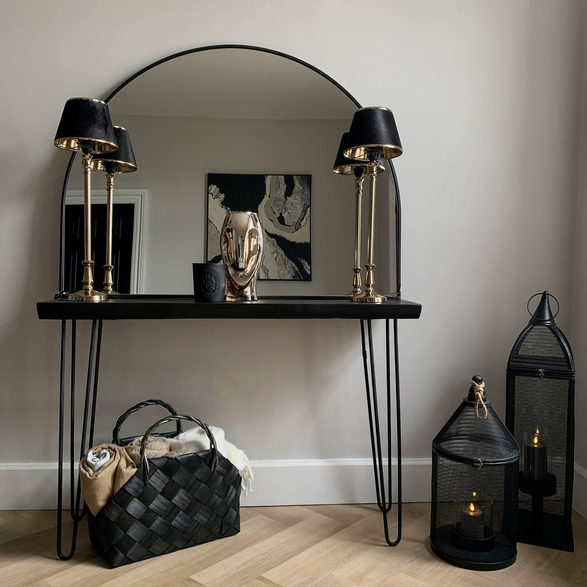 Black Wide Arched Metal Overmantle Mirror leaning against wall