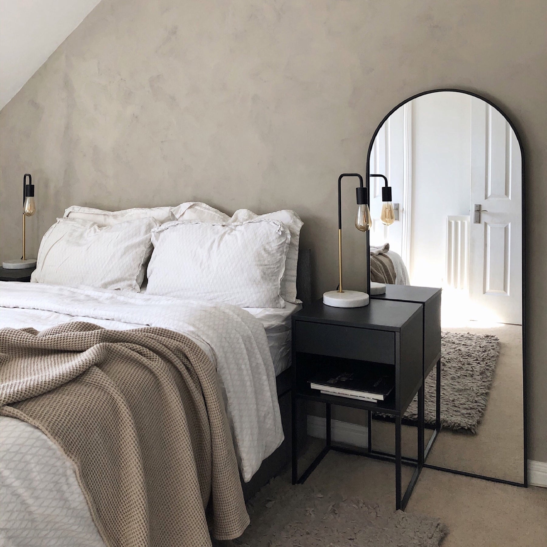 Black Full Length Arched Metal Mirror in bedroom