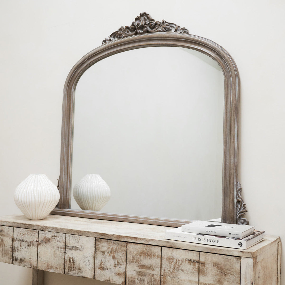 Our washed wood mantle mirror on a console table