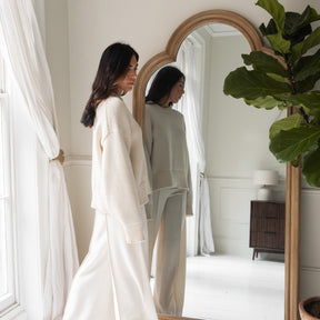 Washed Wood Arched Full Length Mirror with woman standing in frame