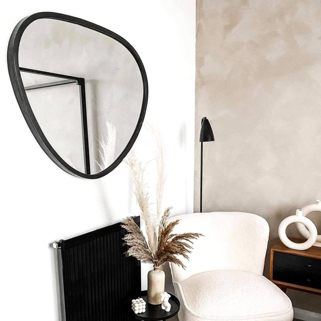 Large Black Irregular Metal Wall Mirror above radiator