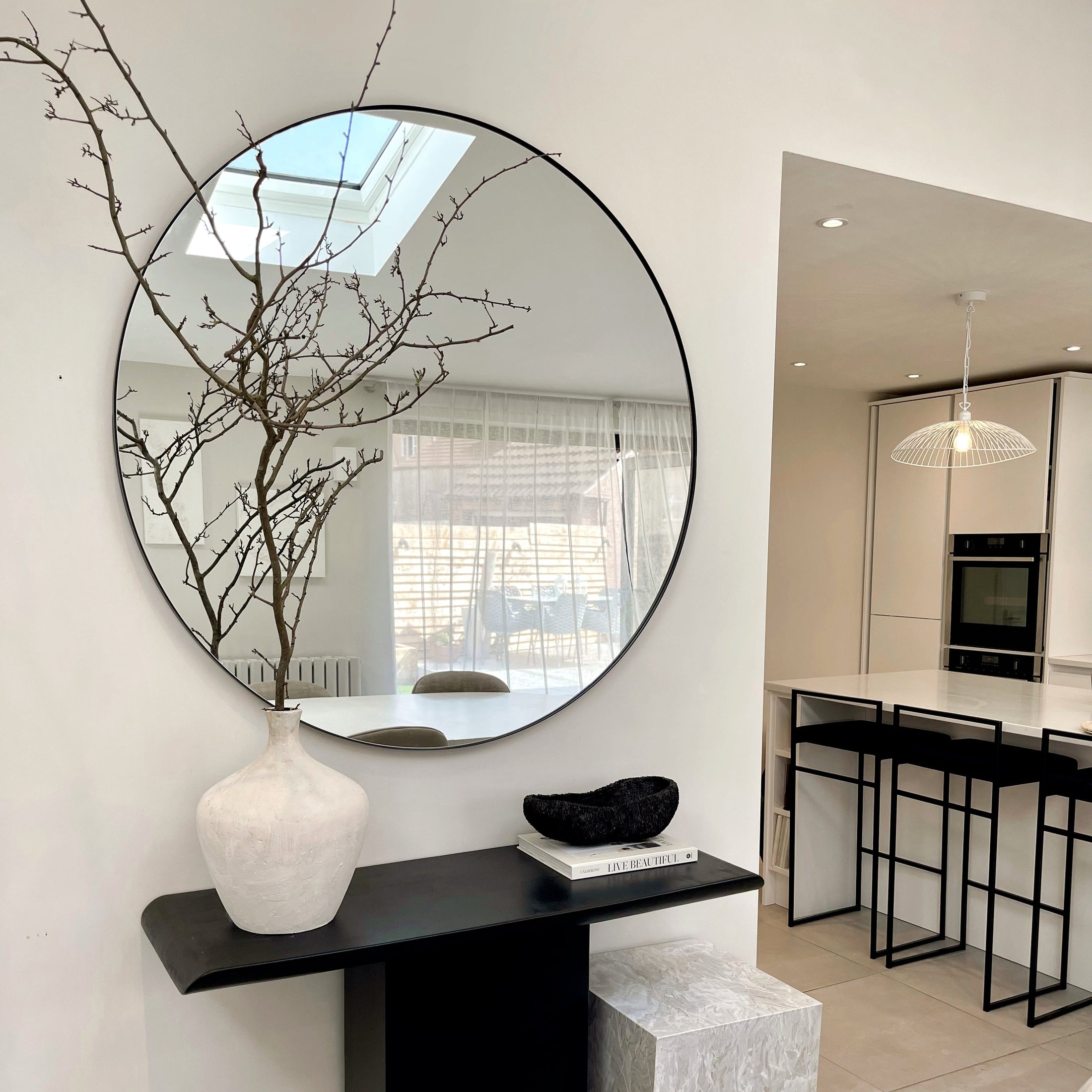Black Round Metal Extra Large Wall Mirror on kitchen wall