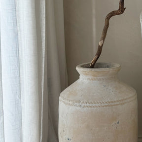 Sand Textured Terracotta Large Vase beside fabrics