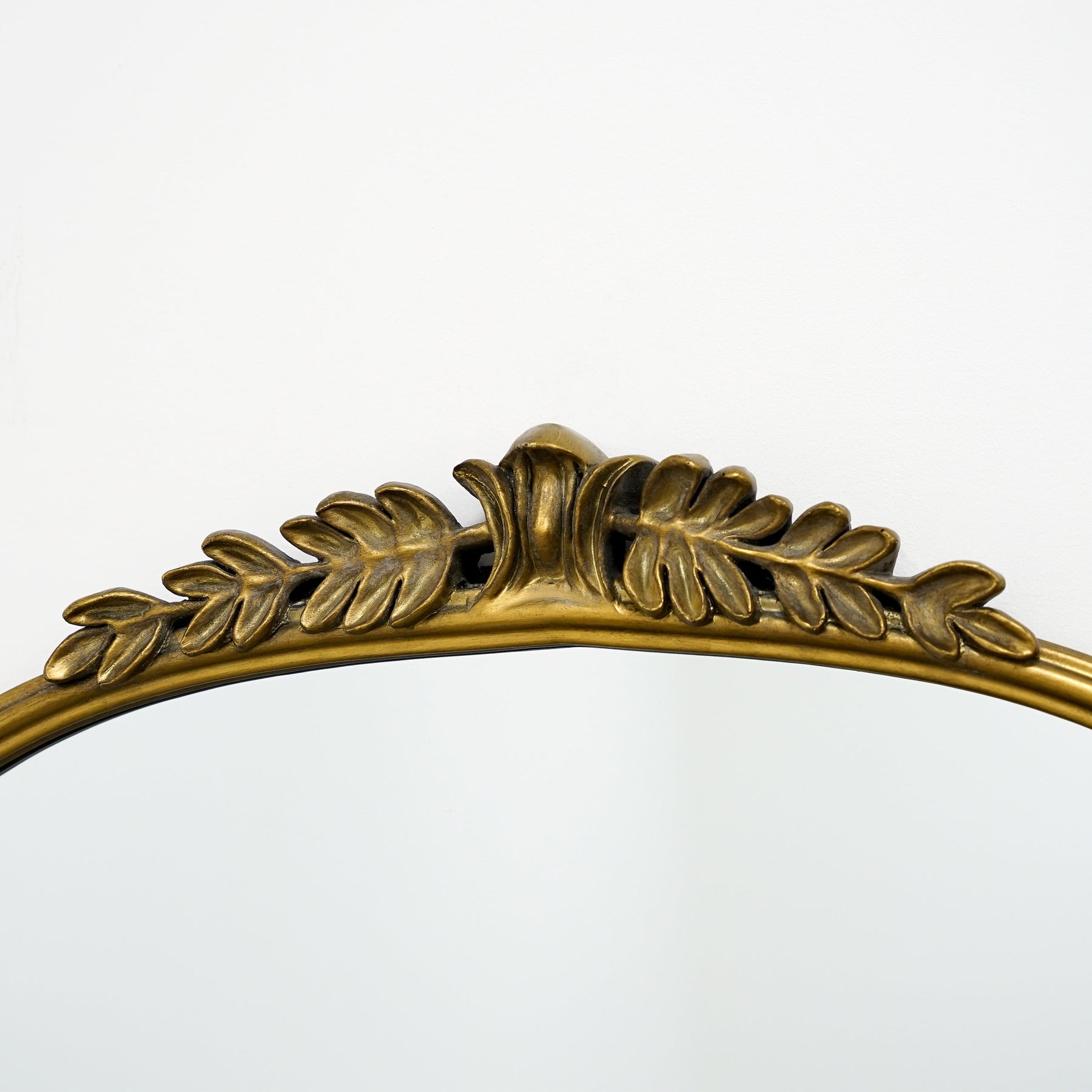 Detail shot of Full Length Gold Arched Ornate Metal Mirror top crest