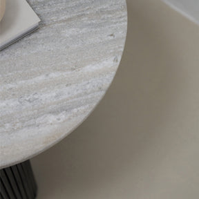 Travertine round side table closeup