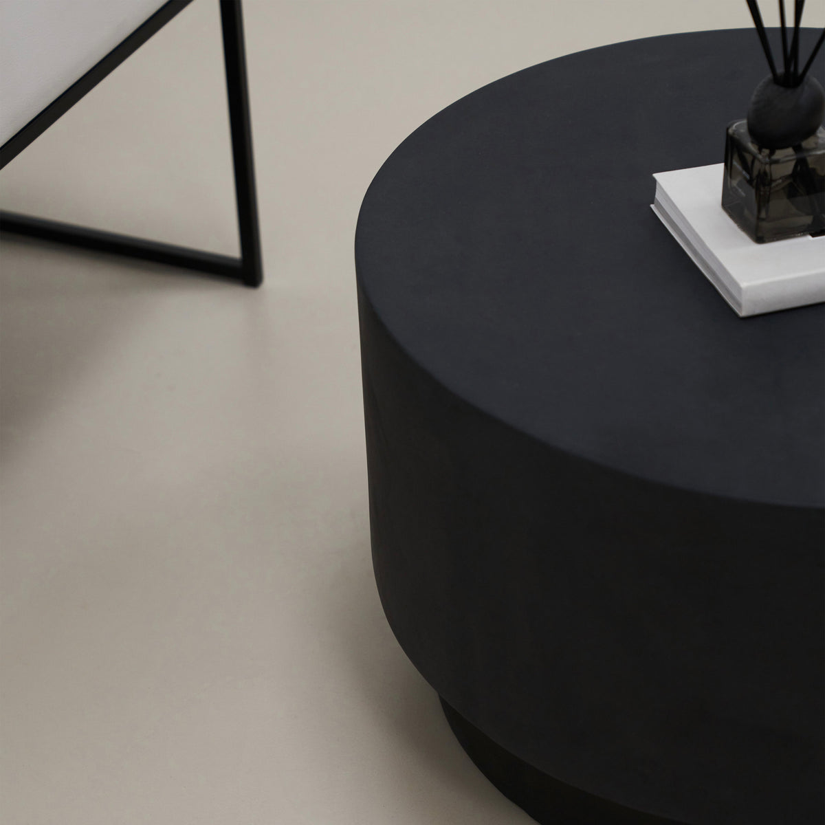Closeup of Minimalist round black coffee table