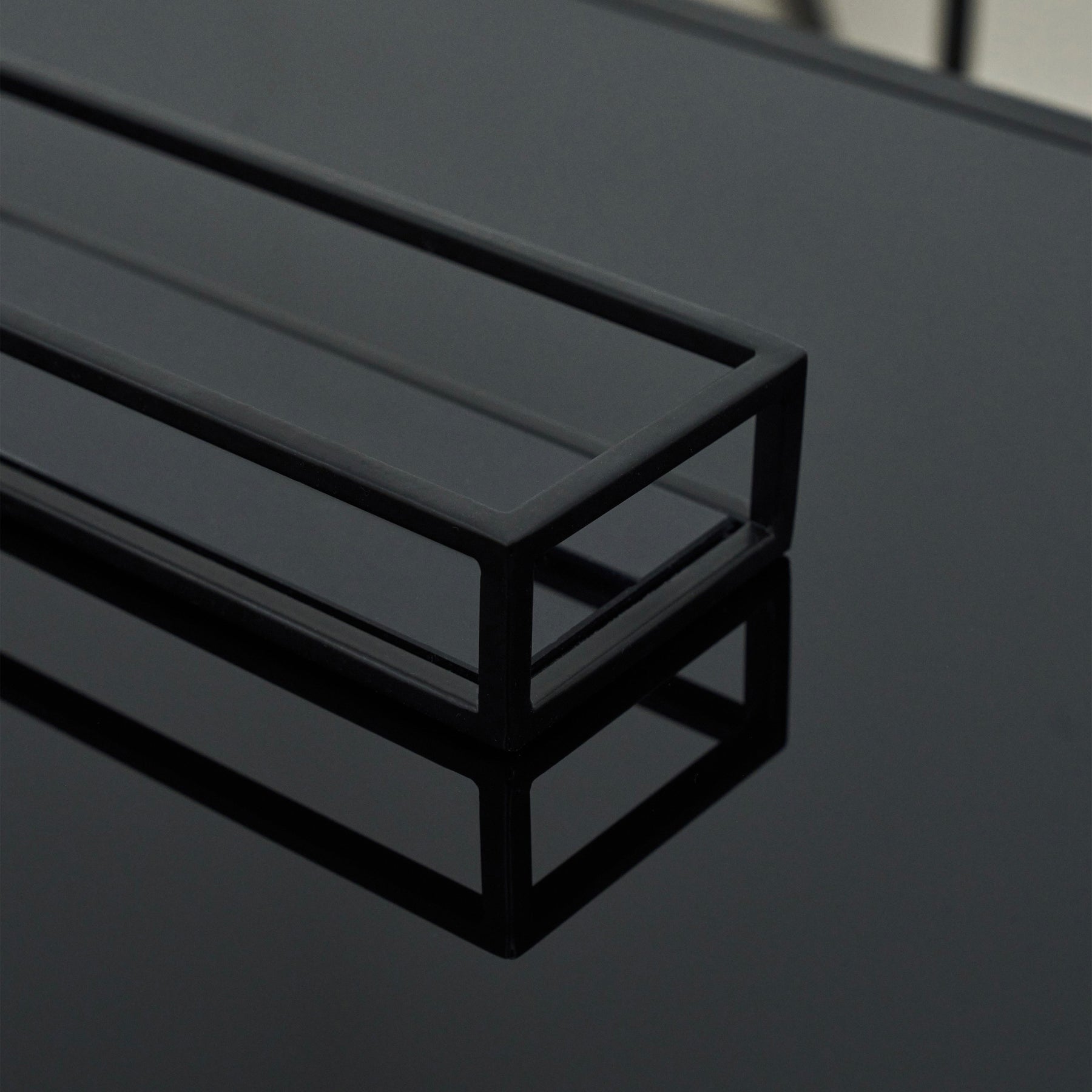 Detail shot of Black modern large rectangle tinted mirrored decorative tray corner