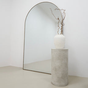 Minimal Concrete Ribbed Plinth beside mirror