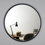 Black Metal Modern Round Wall Mirror on living room wall