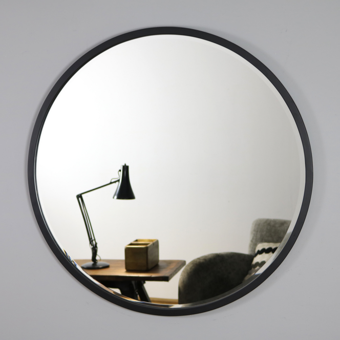 Black Metal Modern Round Wall Mirror on living room wall