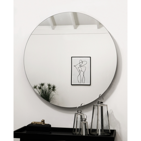 Large Frameless Round Wall Mirror reflecting painting