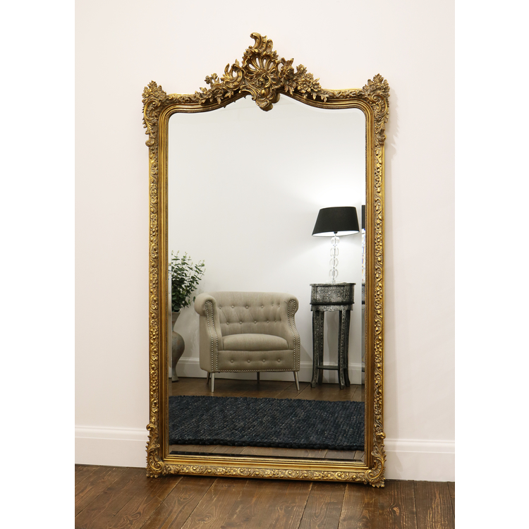 Gold Arched Ornate Full Length Mirror leaning against wall