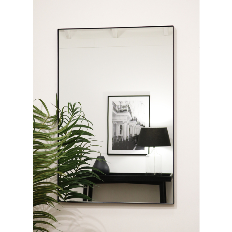 Black Rectangular Metal Wall Mirror opposite painting