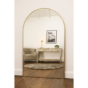 Gold Full Length Arched Metal Mirror as a lounge lean to