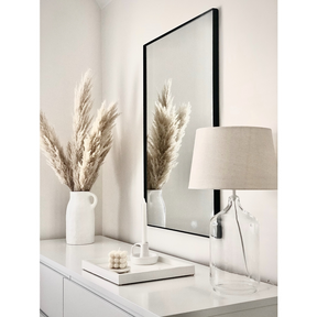 Black Rectangular Metal Wall Mirror beside ceramics