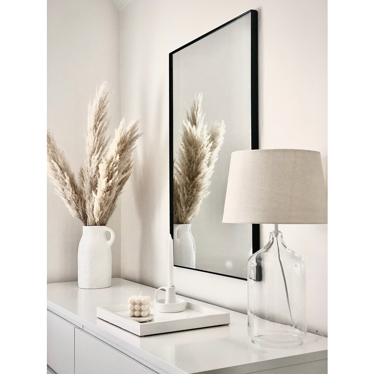 Black Rectangular Metal Wall Mirror beside ceramics