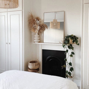 Gold Rectangular Metal Wall Mirror on mantlepiece